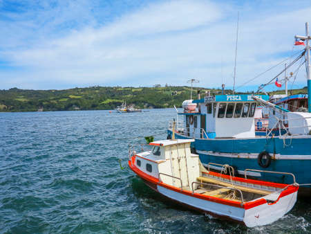 Castro, island of Chiloe, Chile - dec 18, 2013 - view of boat on sea in coast of Castro, is the...