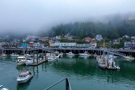 Ketchikan, Alaska - jul 23, 2018 - view of harbour of Ketchikan with fishing boats and mistのeditorial素材