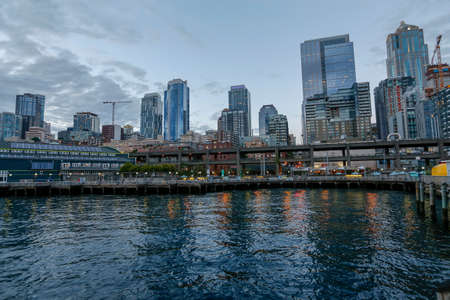 Seattle, Washington, USA - july 20, 2018 -  waterfront skyline at dusk with piers and skyscrapers from the Downtown Districtのeditorial素材