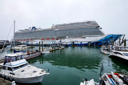 Ketchikan, Alaska - jul 23, 2018 - boats on harbor with cruise liner docked on background in...