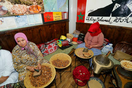Marrakesh, Morocco - may 28, 2019 -  Muslim women making argan oil in Jemma Dar Fna traditional souk in Morocco. Production of argan oil used for cosmetics and in food preparationのeditorial素材