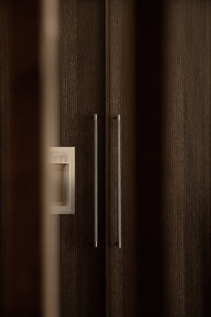 The doors of an in-built fridge In the modern kitchen. A modern built-in fridge with decorative...