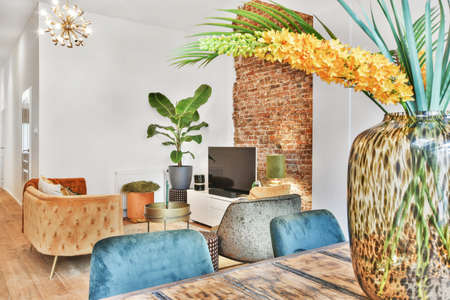 Living room with carpet, mild sofa, table, and other luxury furnitureの写真素材