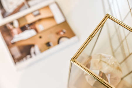 Close-up of glass box with magazine in blurred backgroundの写真素材