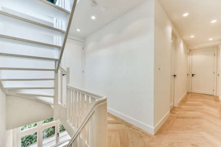 Designed in a minimalistic style staircase hall. Interior of luxury house stair hallの写真素材