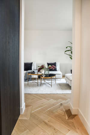 A cozy living room with sofa and decorative tableの写真素材