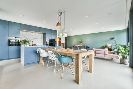 Spacious dining room with wooden table and chairs in a variety of designs