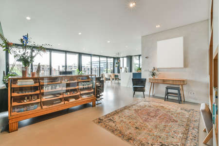 Large bright room with a furniture and a painting on the wallの写真素材