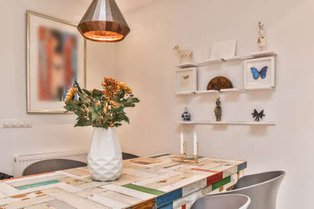 Interior of a bright room in luxury home with decorations and pot of home plantの写真素材