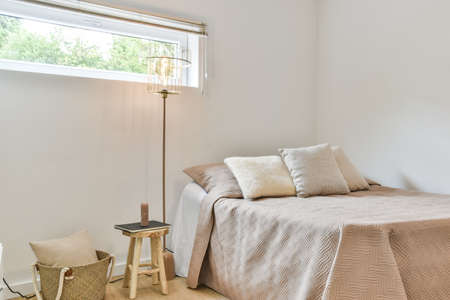 A bright bedroom interior. Modern minimalistic bedroomの写真素材