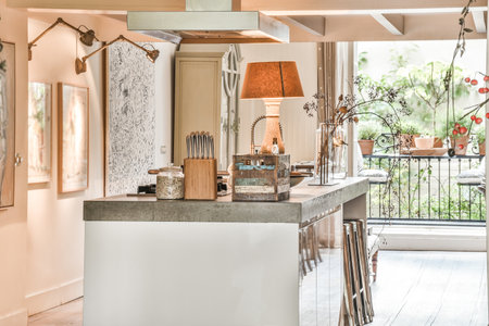 Bright kitchen with luxury kitchen island in elegant houseの写真素材