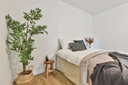 A bright bedroom interior. Modern minimalistic bedroomの写真素材