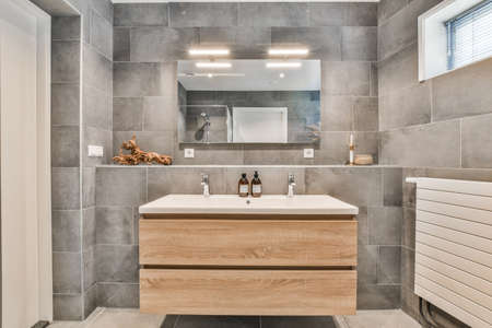 Bright elegant bathroom interior with marble wallsの写真素材