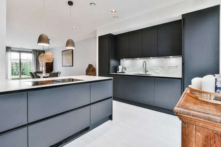 Beautiful and spacious kitchen in an elegant homeの写真素材