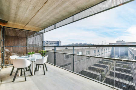 Beautiful balcony of an elegant home with chairsの写真素材