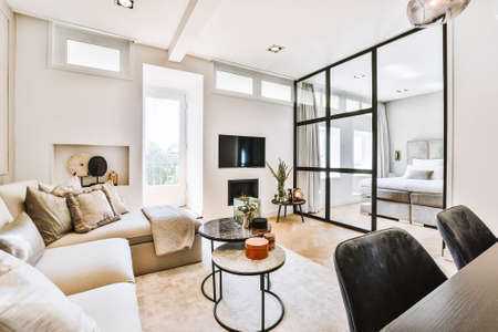 Modern flat with spacious bedroom and cozy living room designed in minimal styleの写真素材