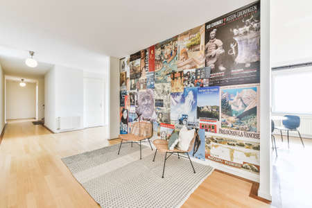 Amsterdam, Netherlands - 1 May, 2021: Interior of a spacious room with posters on the wall in a...