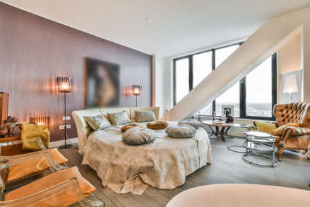 Interior of a cozy and bright bedroom with beautiful furniture