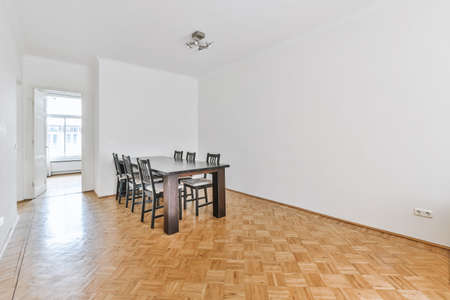Huge empty dining room with a table and chairs