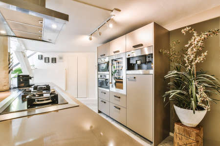 Interior of a beautiful kitchen in cozy apartmentの写真素材