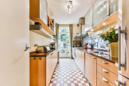 Interior of a beautiful kitchen in cozy apartmentの写真素材