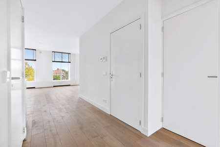 A cozy and spacious room in a luxury houseの写真素材