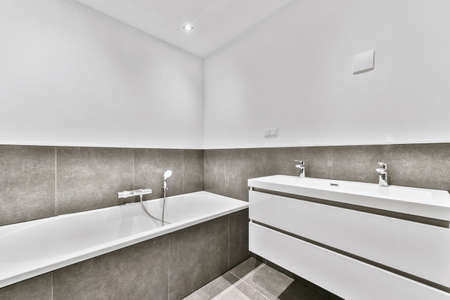 Interior of modern bathroom with bathtub and showerの写真素材