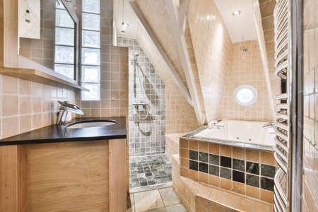 Beautiful bathroom with a stylish bathtub and white walls