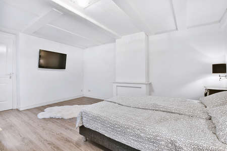 Interior of a cozy and bright bedroom with beautiful decorationの写真素材