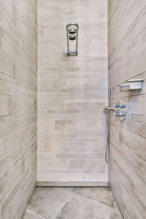 Modern shower stall in a bright bathroom