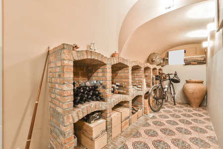 A long empty corridor with champagne shelves on the wall