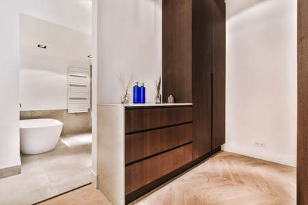 Beautiful bathroom with a big bathtub and white big windows