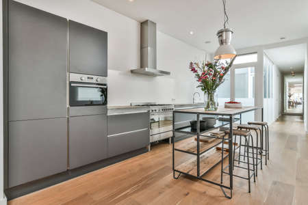 Beautiful and spacious kitchen in an elegant homeの写真素材