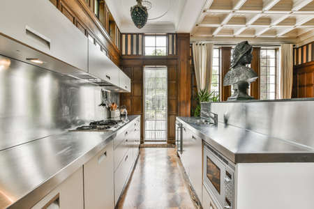 Beautiful and spacious kitchen in an elegant homeの写真素材