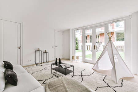Interior of bright living room with stylish furniture
