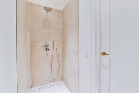 Modern shower stall in a bright bathroom