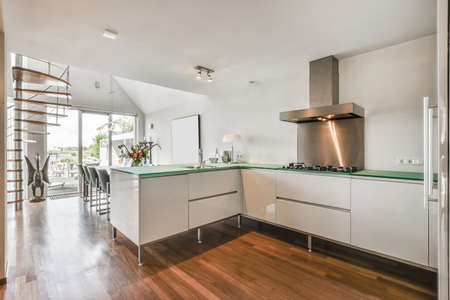 Beautiful and spacious kitchen in an elegant homeの写真素材