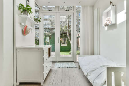 A cozy and spacious room in a luxury houseの写真素材