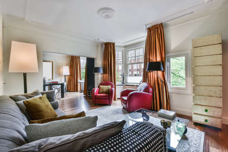 Interior of bright living room with stylish furniture