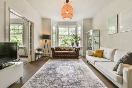 Interior of bright living room with stylish furnitureの写真素材