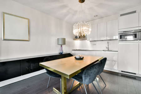 Stylish dining room with decorative table and chairsの写真素材