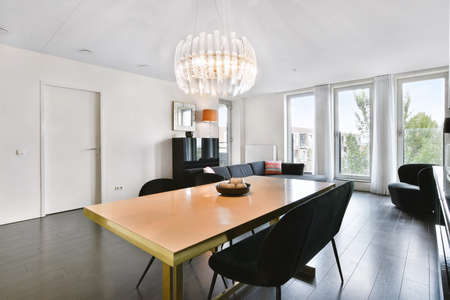 Stylish dining room with decorative table and chairsの写真素材