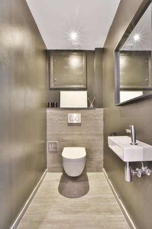 Interior of small clean toilet in miniature styleの写真素材