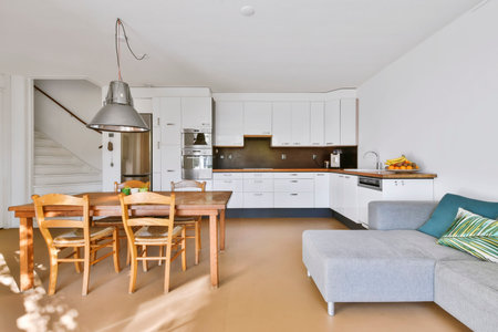 Stylish dining room with decorative table and chairsの写真素材