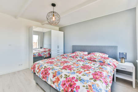 Interior of a cozy and bright bedroom with beautiful decoration