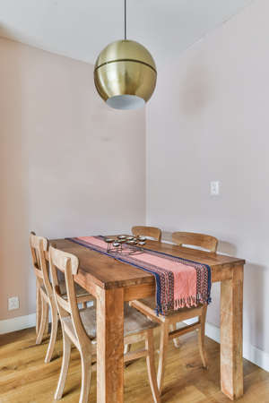 Stylish dining room with decorative table and chairs