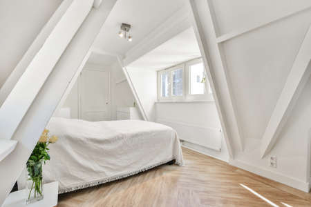 Interior of a cozy and bright bedroom with beautiful decoration