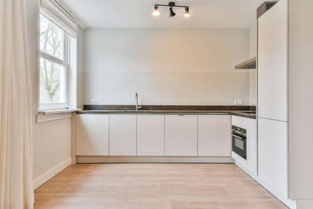 Interior of a beautiful kitchen in modern apartmentの写真素材
