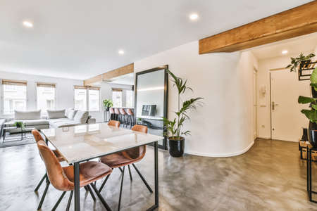 Stylish dining room with decorative table and chairs