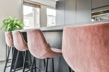 Stylish dining room with decorative table and chairsの写真素材